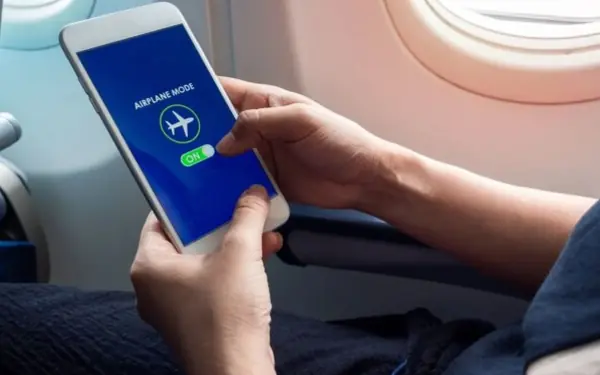 Why do flight attendants always remind passengers to turn off their phones when planes take off and land?