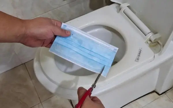 Throw the mask into the toilet, it won't get dirty or smell