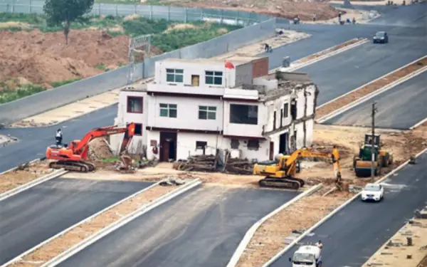 The houses are ruining the beautiful road