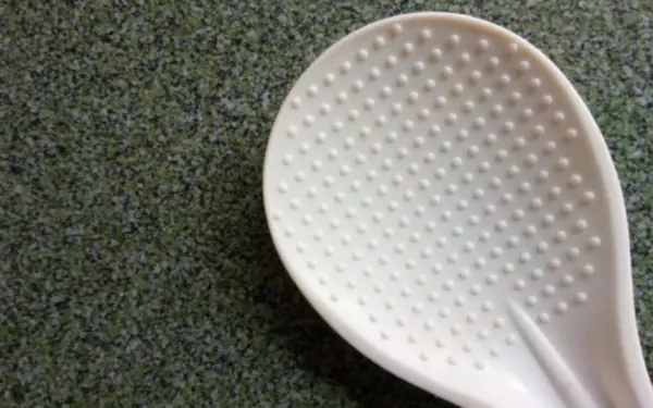 Why does the rice spoon have a round tip?