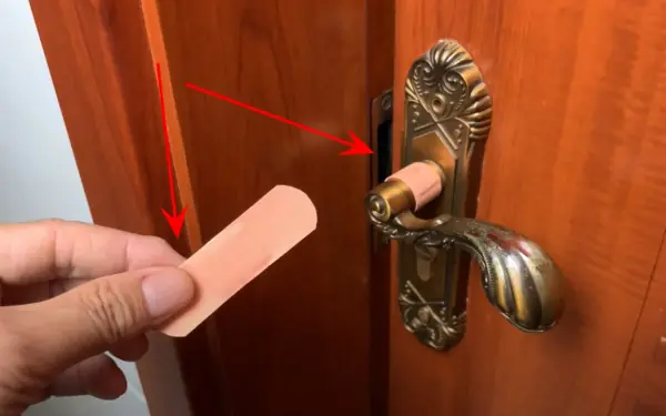 Stick a band-aid on the door