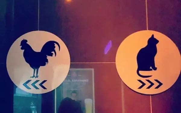Humorous restroom door signs
