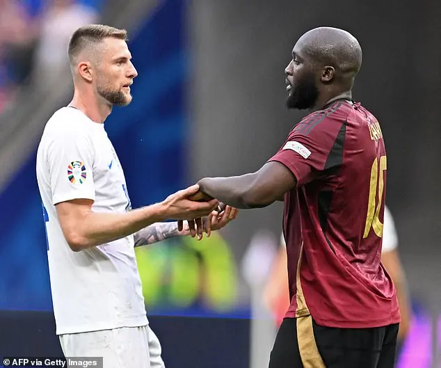 Lukaku congratulates former team-mate and Slovakia captain Milan Skriniar after the game