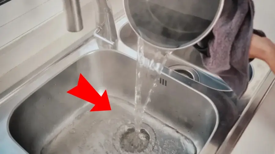 Why should not you pour hot water into the sink?