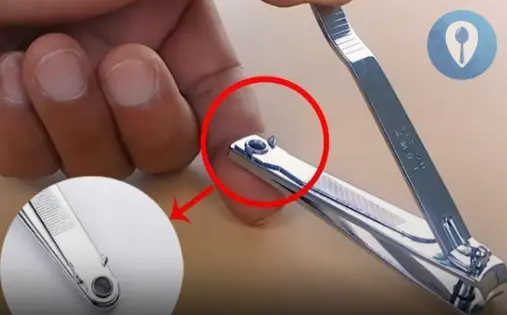 A small round hole at the end of the nail clip