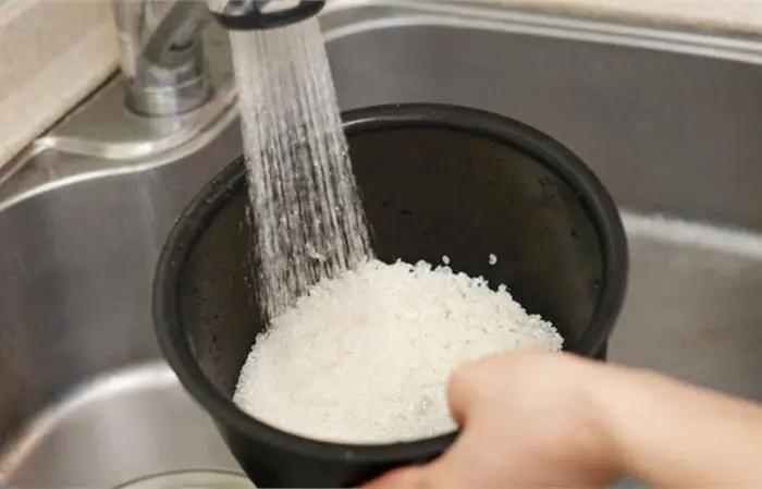 Why you shouldn't wash rice in the inner pot of a rice cooker?