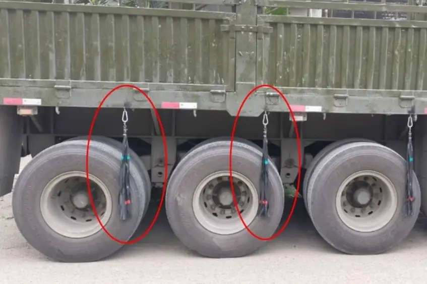 Why are rubber bands tied to truck tires?