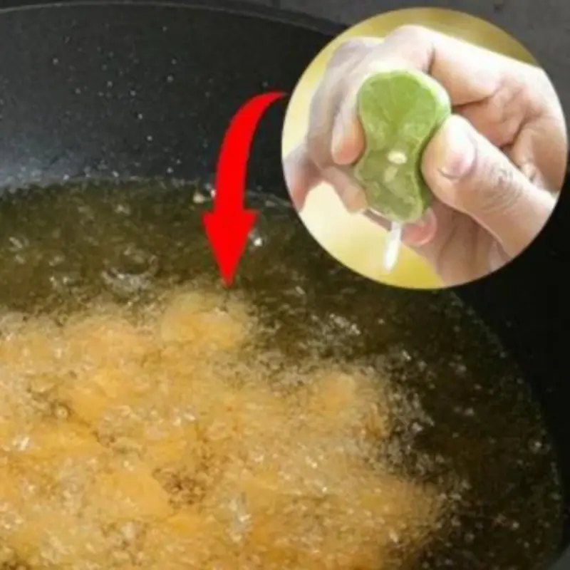 What is the effect of squeezing lemon juice into the frying oil before frying?