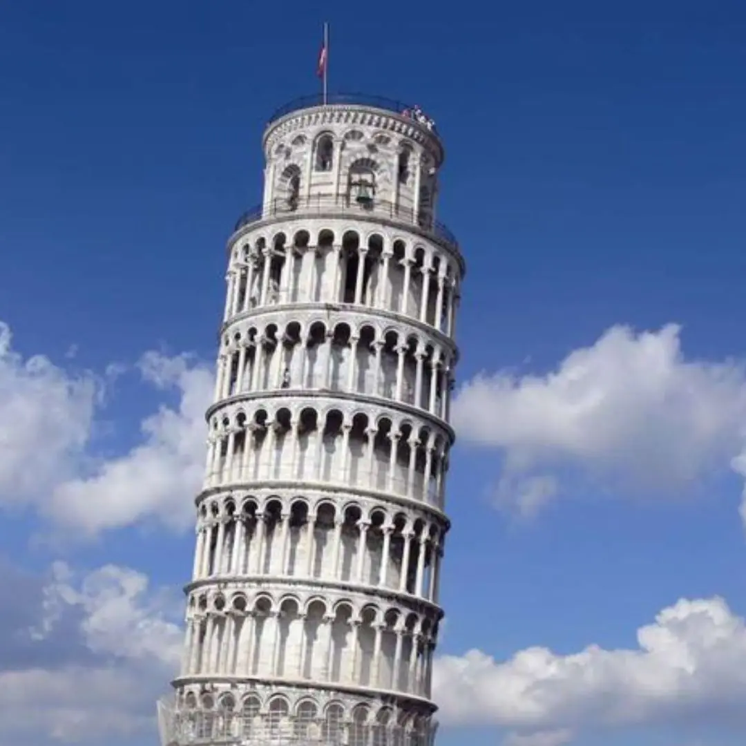 Why does the leaning tower of Pisa keep leaning but not falling?