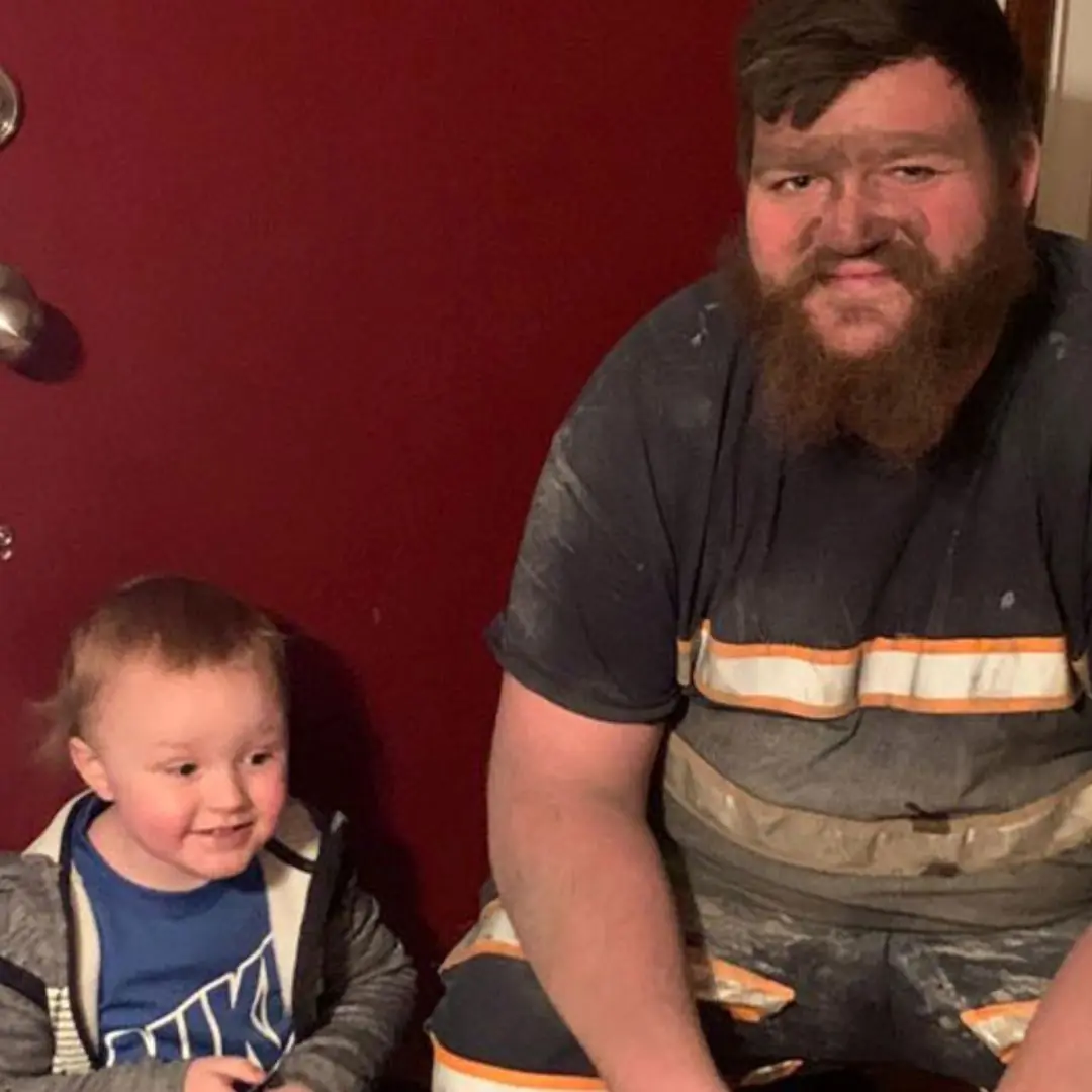 Miner took his son to the game immediately following work – he had no time to shower