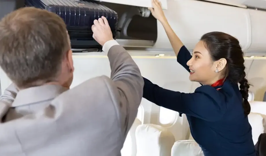 The Truth Behind Why Flight Attendants Don’t Lift Passengers’ Bags