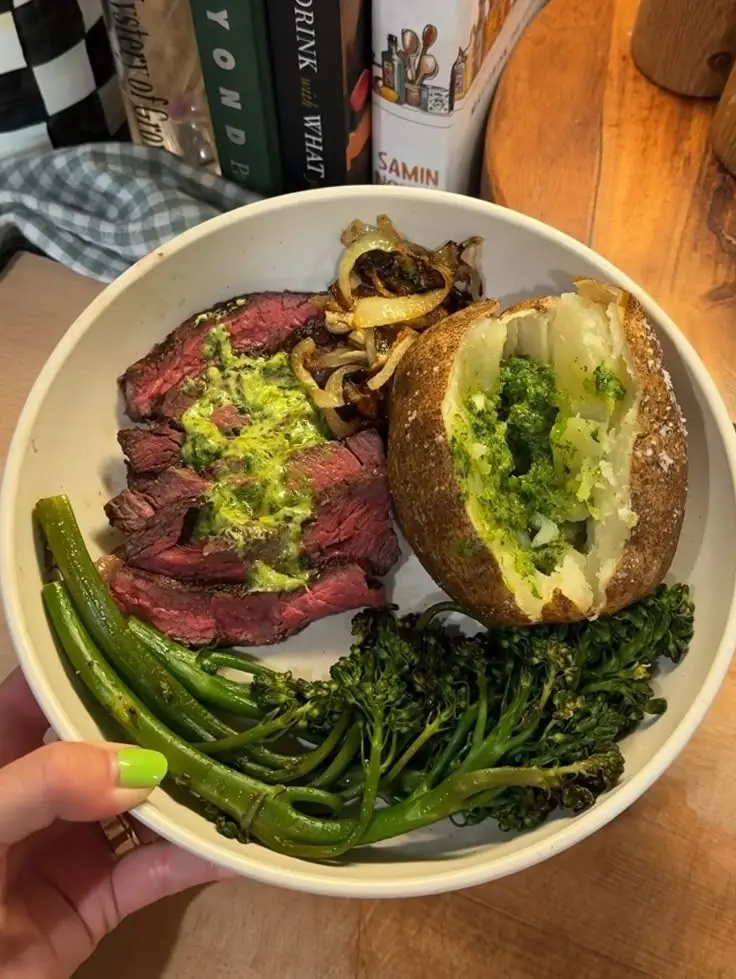 Grilled Steak with Roasted Broccolini, Baked Potato with Pesto, and Caramelized Onions