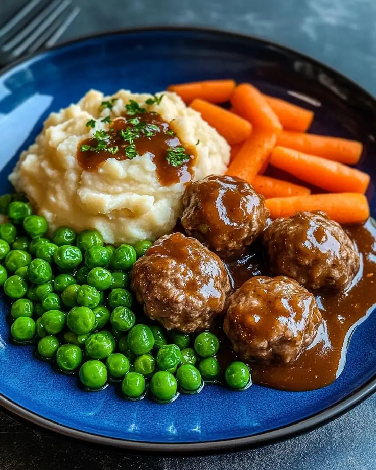 Meatballs with Gravy, Mashed Potatoes, Peas & Glazed Carrots