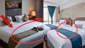 Ever Wondered Why Hotels Put a Cloth Across the Bed? Here’s the Answer