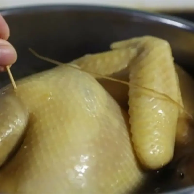 The water used to boil chicken helps keep the meat firm, sweet, and intact.