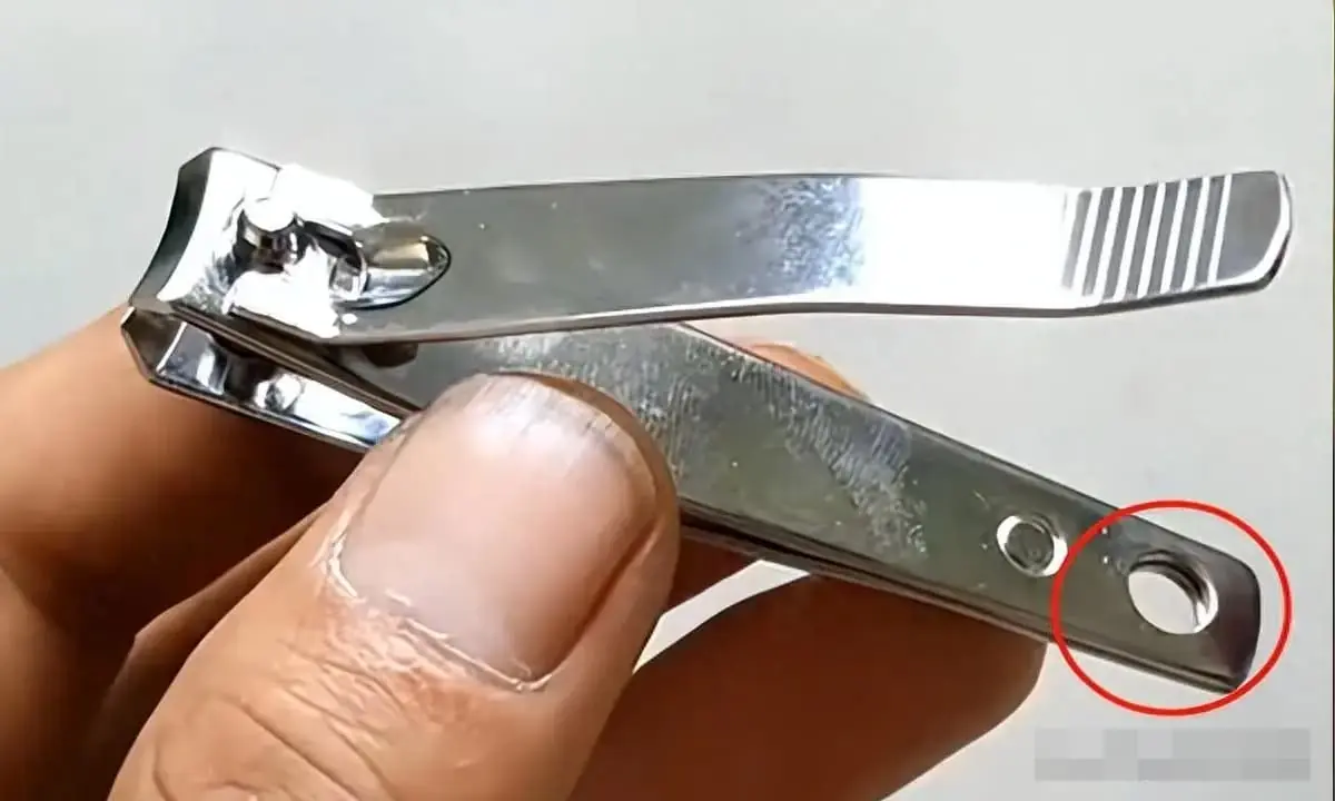 What does the little hole in a nail clipper actually do?