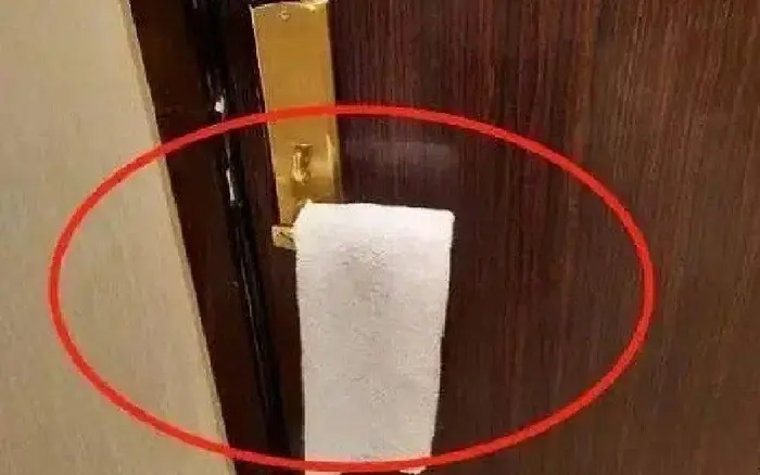 The unexpected benefits of hanging a towel on your door handle at night