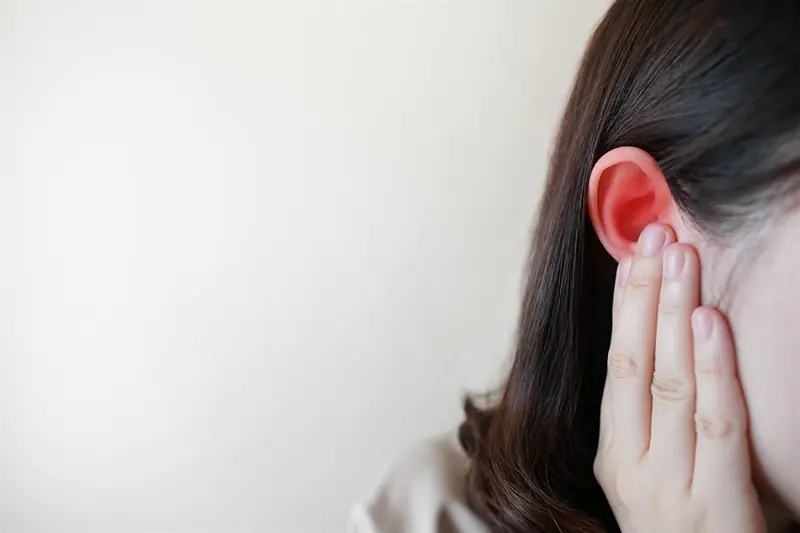 Why does my ear suddenly feel hot or flushed even when nothing seems wrong?