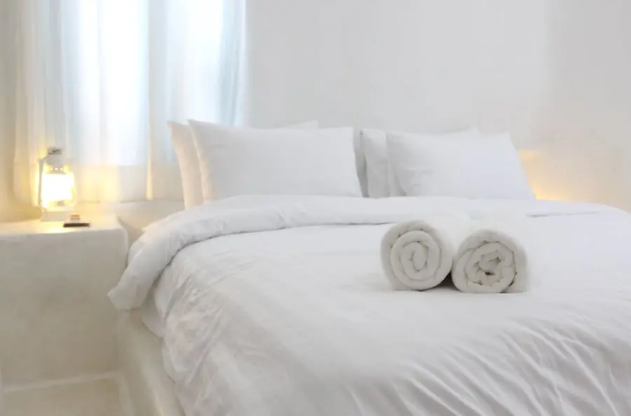 Why hotels almost always use white sheets on their beds?
