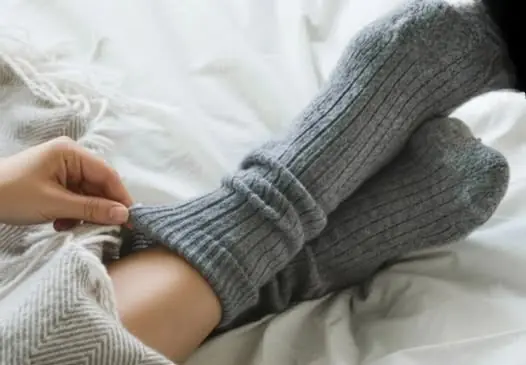 Here’s What Really Happens When You Sleep with Socks On