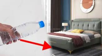 Why should you check under the bed with a water bottle when staying in a hotel?