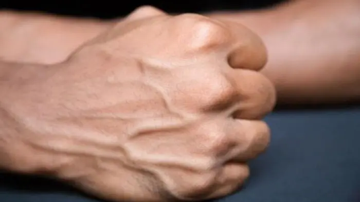 Why do veins appear more prominent on the skin?