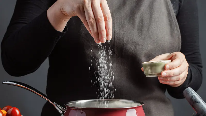How can you fix an overly salty dish without diluting it with water?