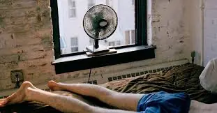 Stop Sleeping Hot: 6 Benefits of a Cooler Room (And Why You Should Skip the Fan)