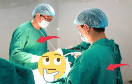 Why do sur.geons wear blue scrubs?