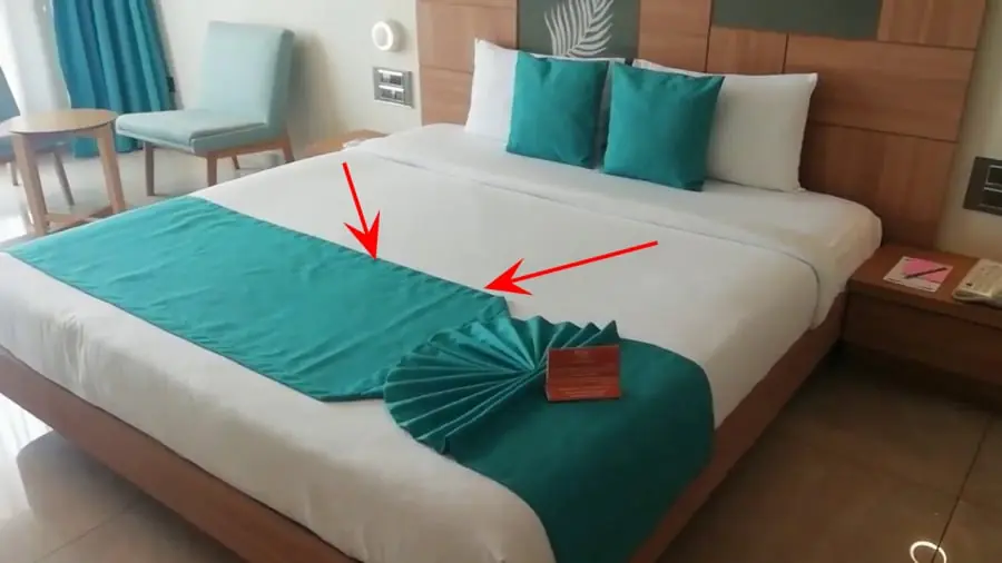 Ever wondered why hotels place a fabric strip at the end of beds?