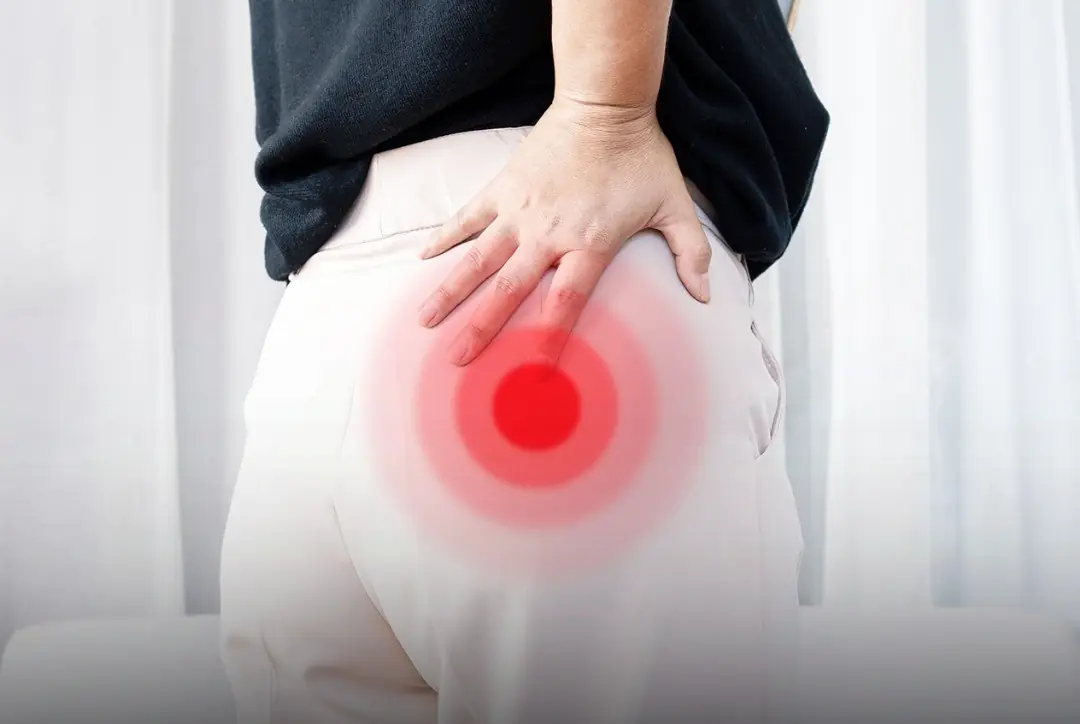 Why might someone experience sore buttocks when they wake up?