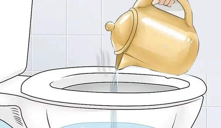 What’s the reason behind adding hot water to a toilet in a hotel room before flushing?