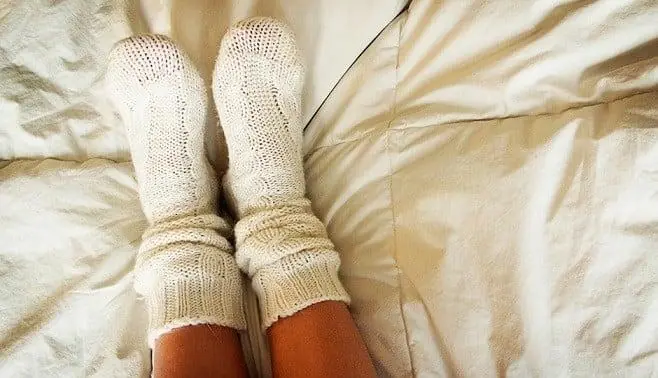 Here’s What Really Happens When You Sleep With Socks On