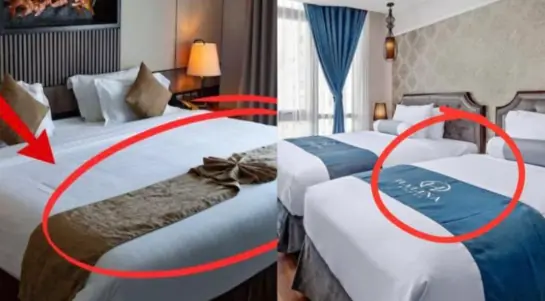 Why do hotels always have a cloth across the bed?