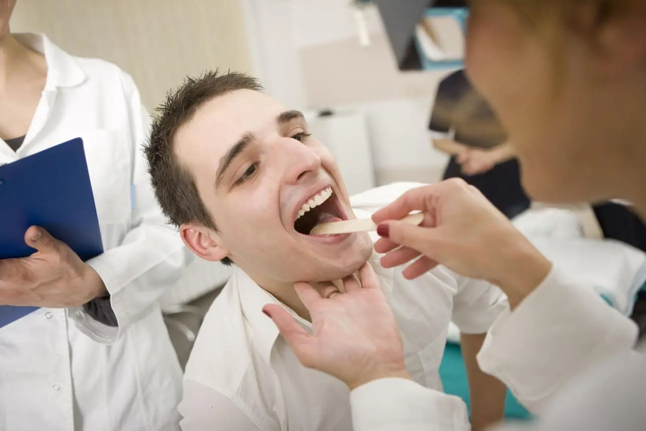 If You Keep Getting These White Bumps in Your Mouth, Here's What They Could Mean