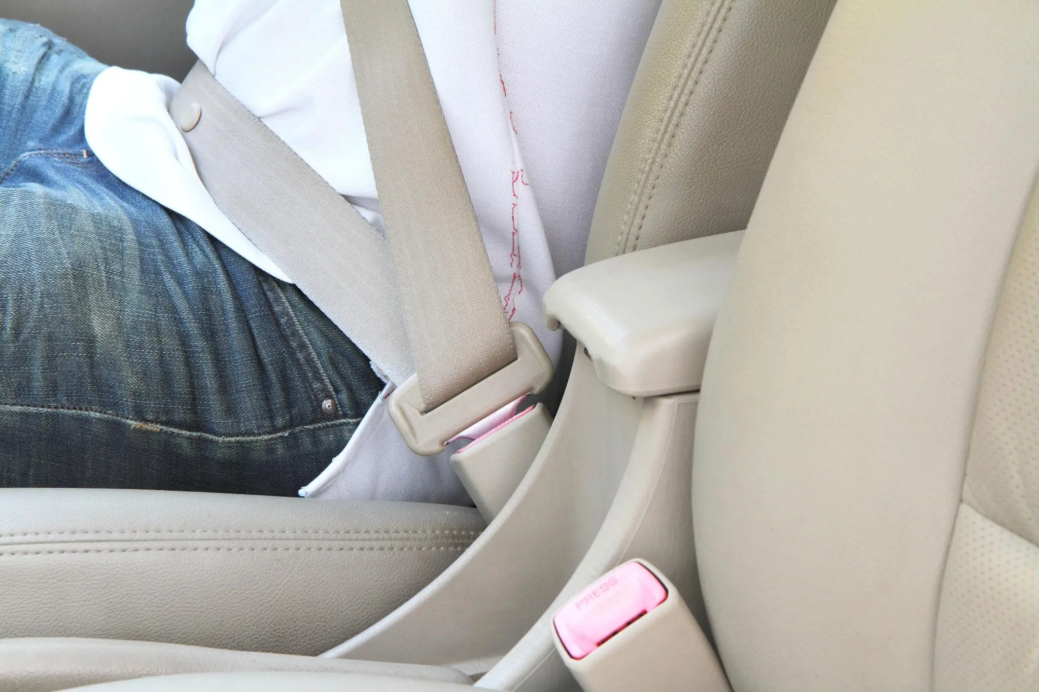We Finally Know What That Little Button on Your Seatbelt Is For