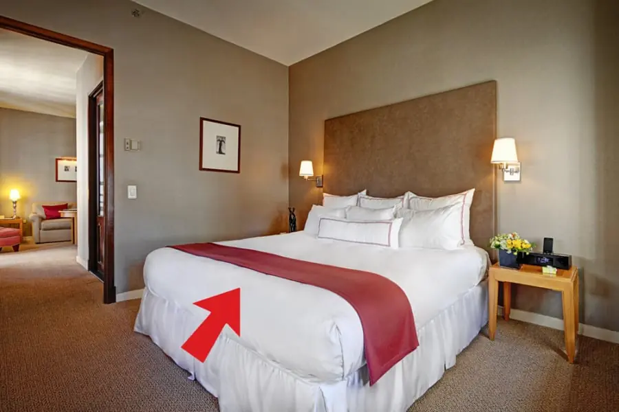 Why Do Hotels Place a Fabric Strip Across the Bed? The Answer May Surprise You