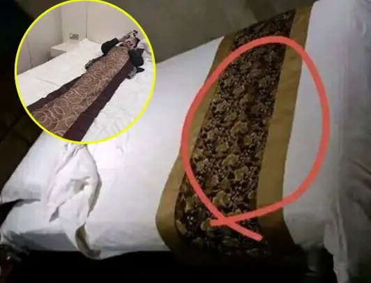 Why do hotels always have a cloth across the bed?
