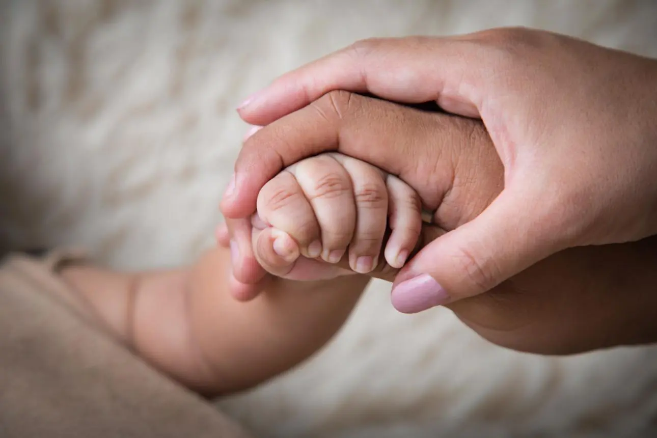 What Does a Purple Butterfly Sticker Near a Newborn Baby Mean?