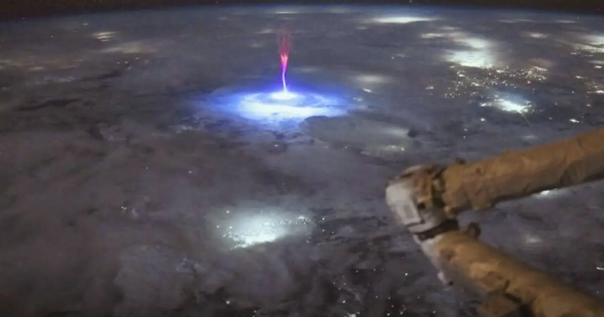 Astronaut Captures a Rare Red Sprite Flashing Above a Powerful Storm