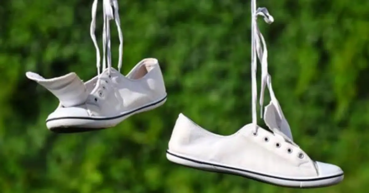 Ever Wondered Why Sneakers Hang From Power Lines? The Mystery Behind This Strange Sight