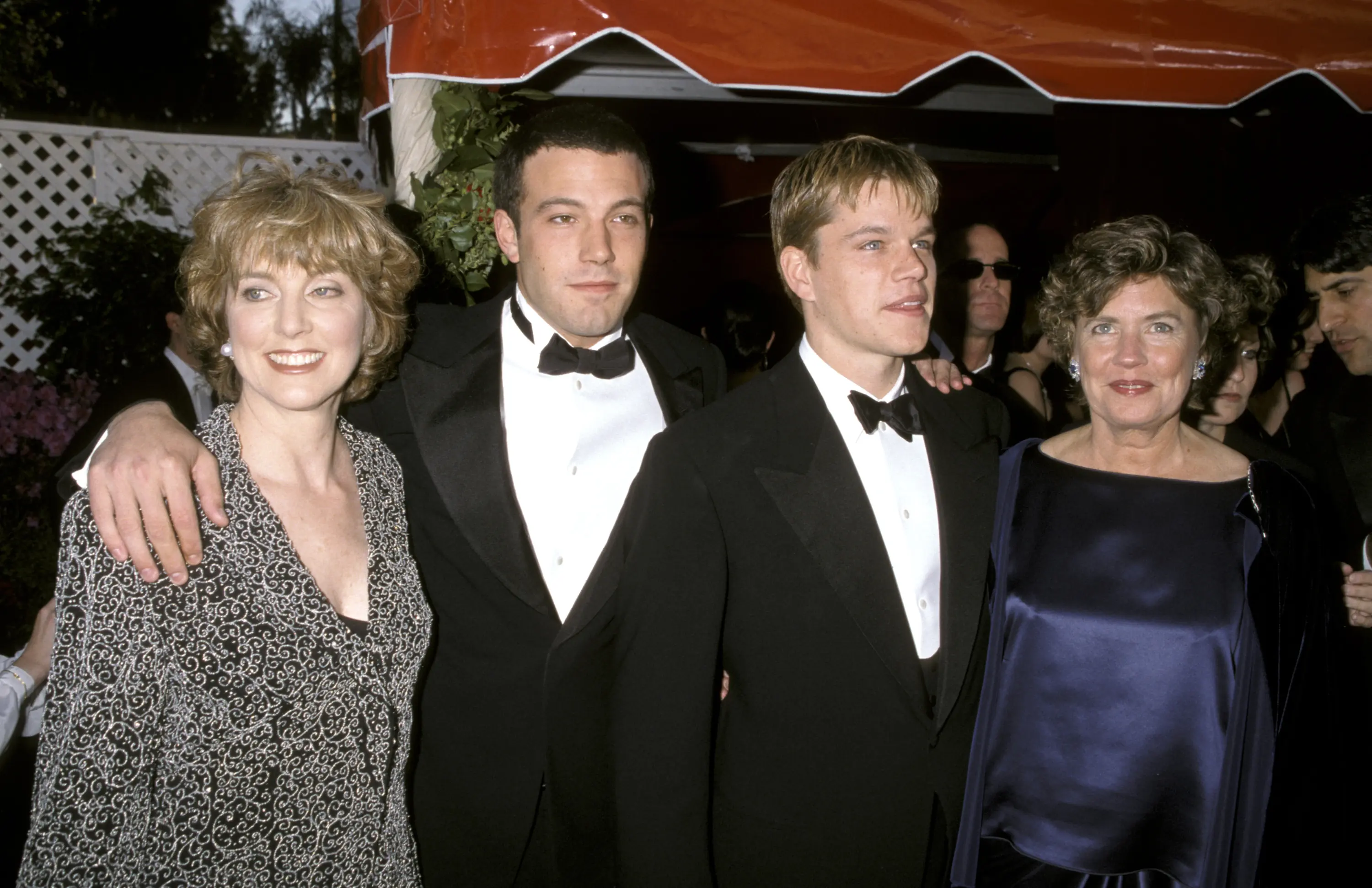 She was a trailblazer who paved the way for her son's iconic career. In this photo, Chris Affleck, Ben Affleck, Matt Damon, and his mother Nancy Carlson-Paige attended the red carpet for the 70th Annual Academy Awards on March 23, 1998, in Los Angeles, California. | Source: Getty Images
